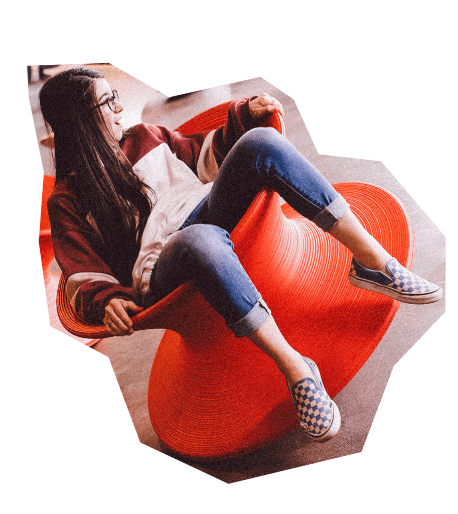 Girl sitting in spinning top chair at the City Museum