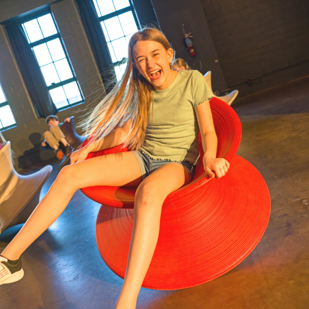 Girl spinning in a Spun Chair